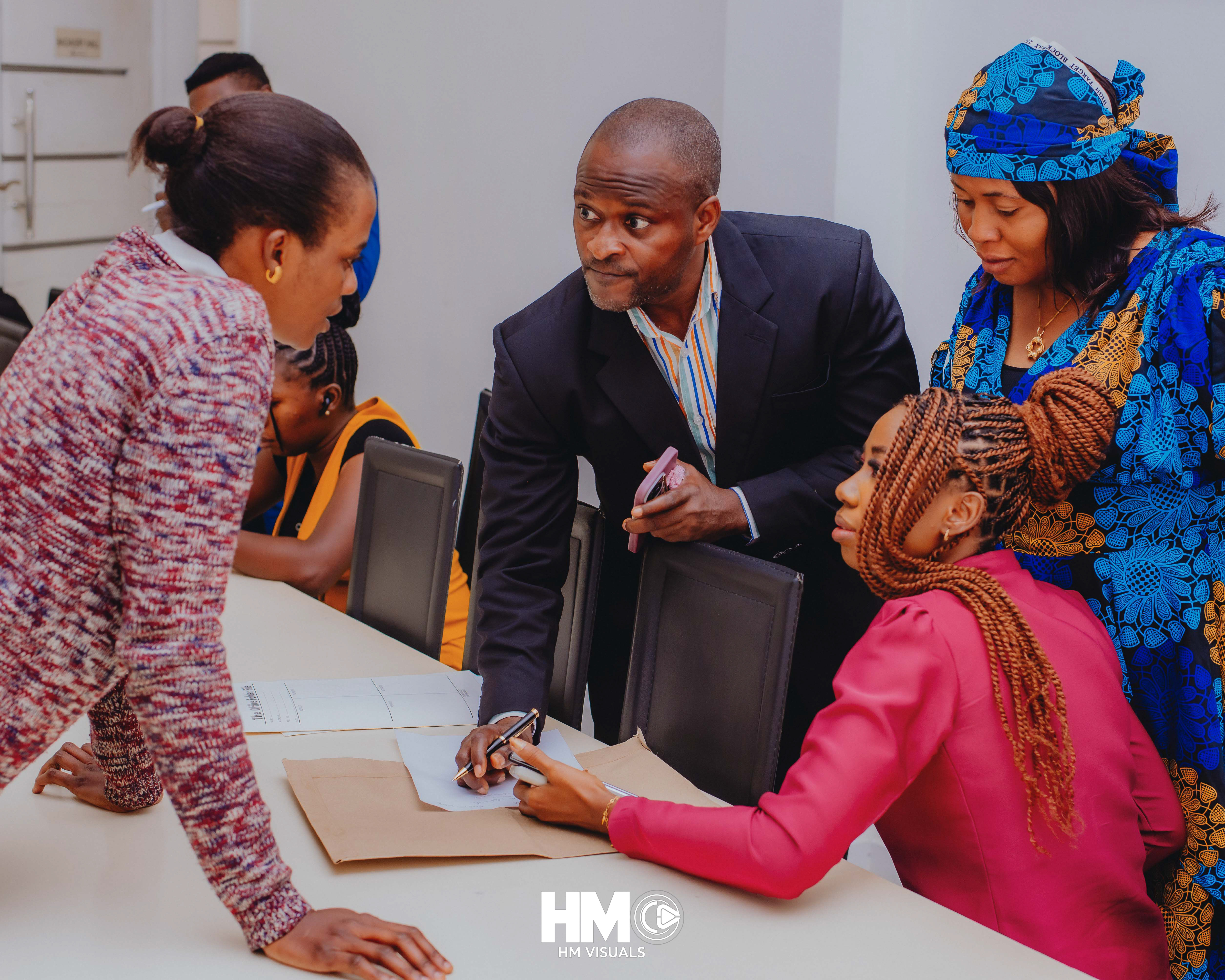 A moment of coordination during the registration session at the Official Opening of Mojisola Grace Humanitarian Foundation.